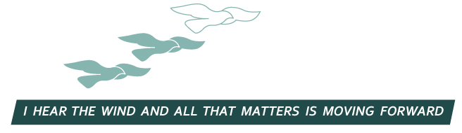 Three stylized birds in flight above the words: I hear the wind and all that matters is moving forward.
